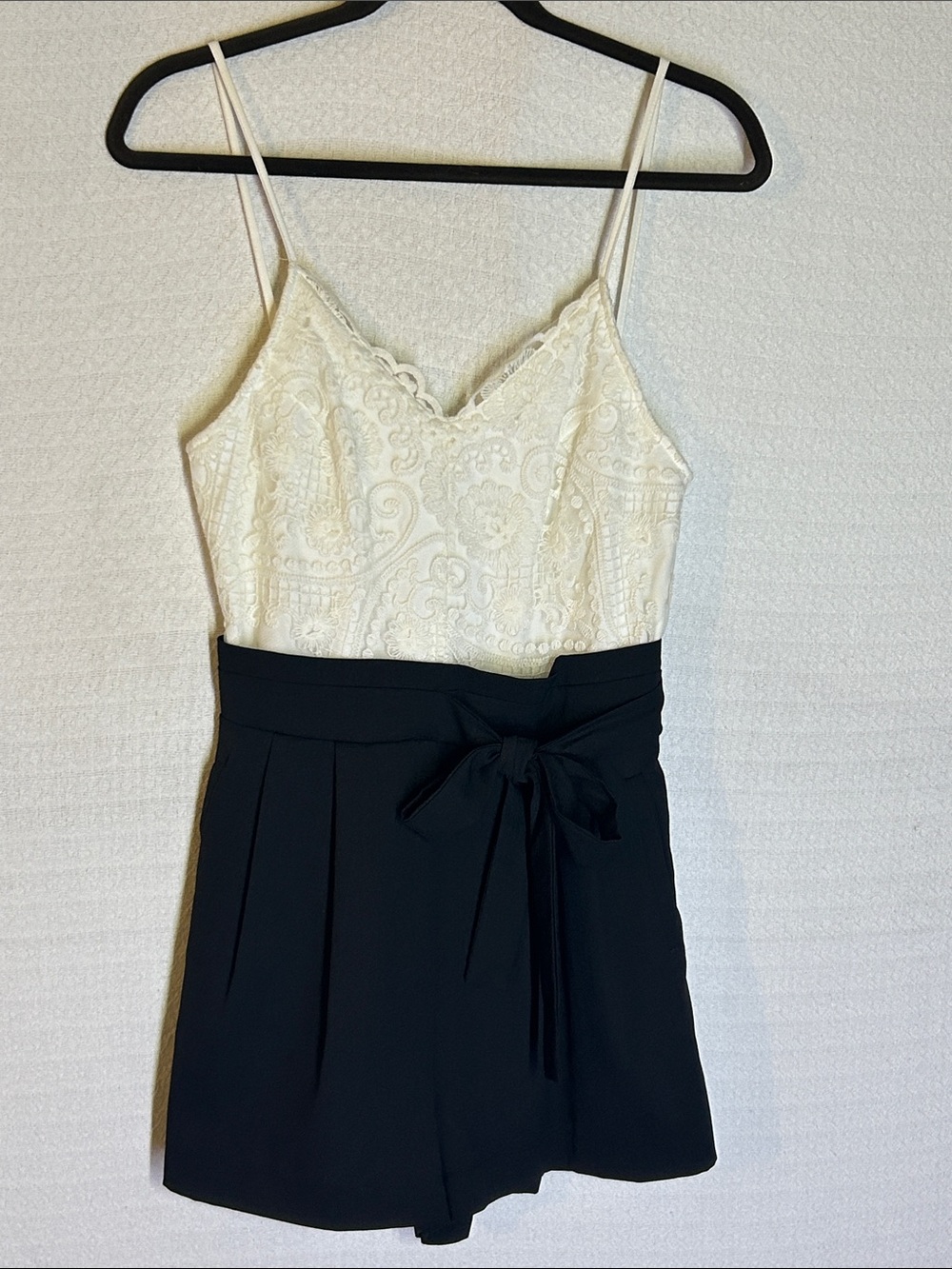 the clothing company Cream Lace Bodice Romper with Black High-Waist Shorts
